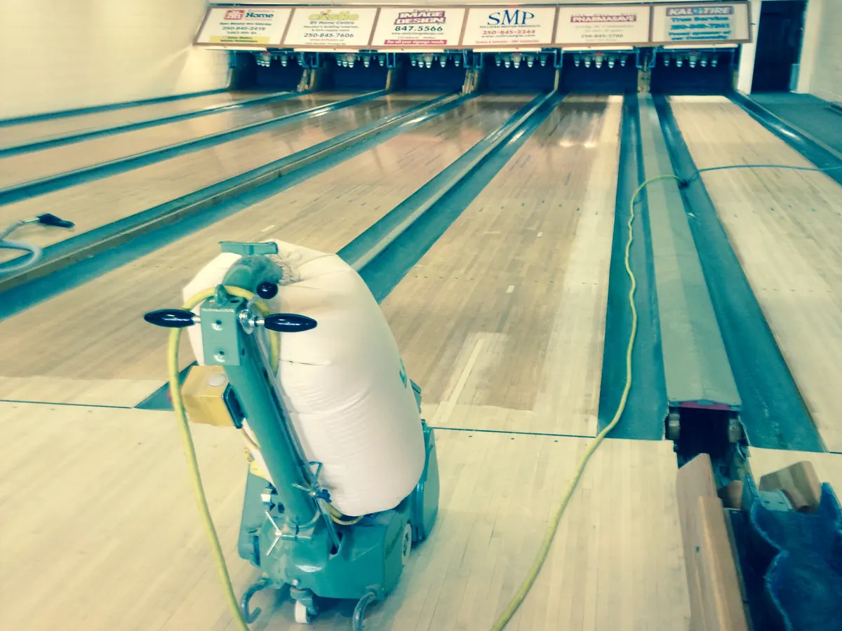 Sanding a bowling lane with dust containment