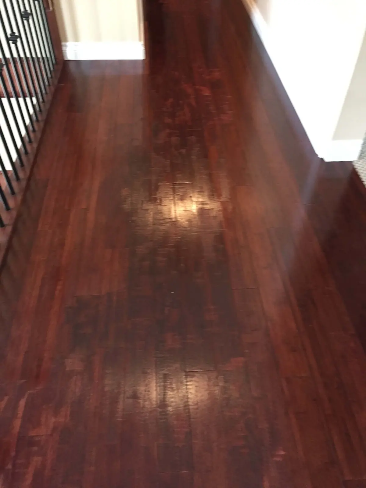 Dark fir floor with a worn, patchy finish