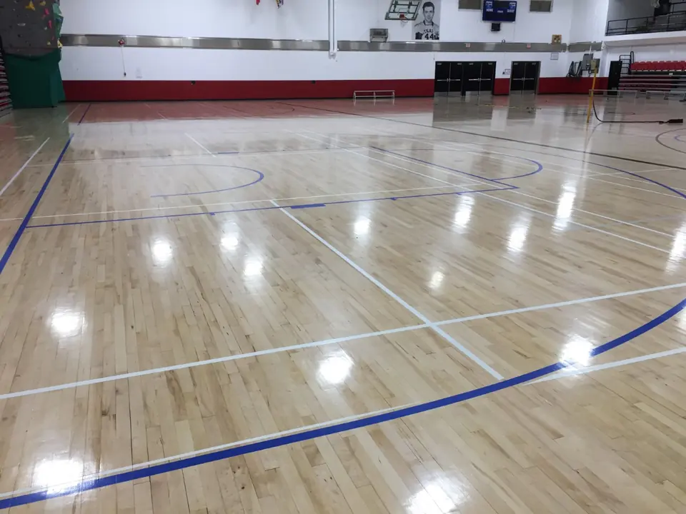 Refinished gymnasium floor with fresh court lines