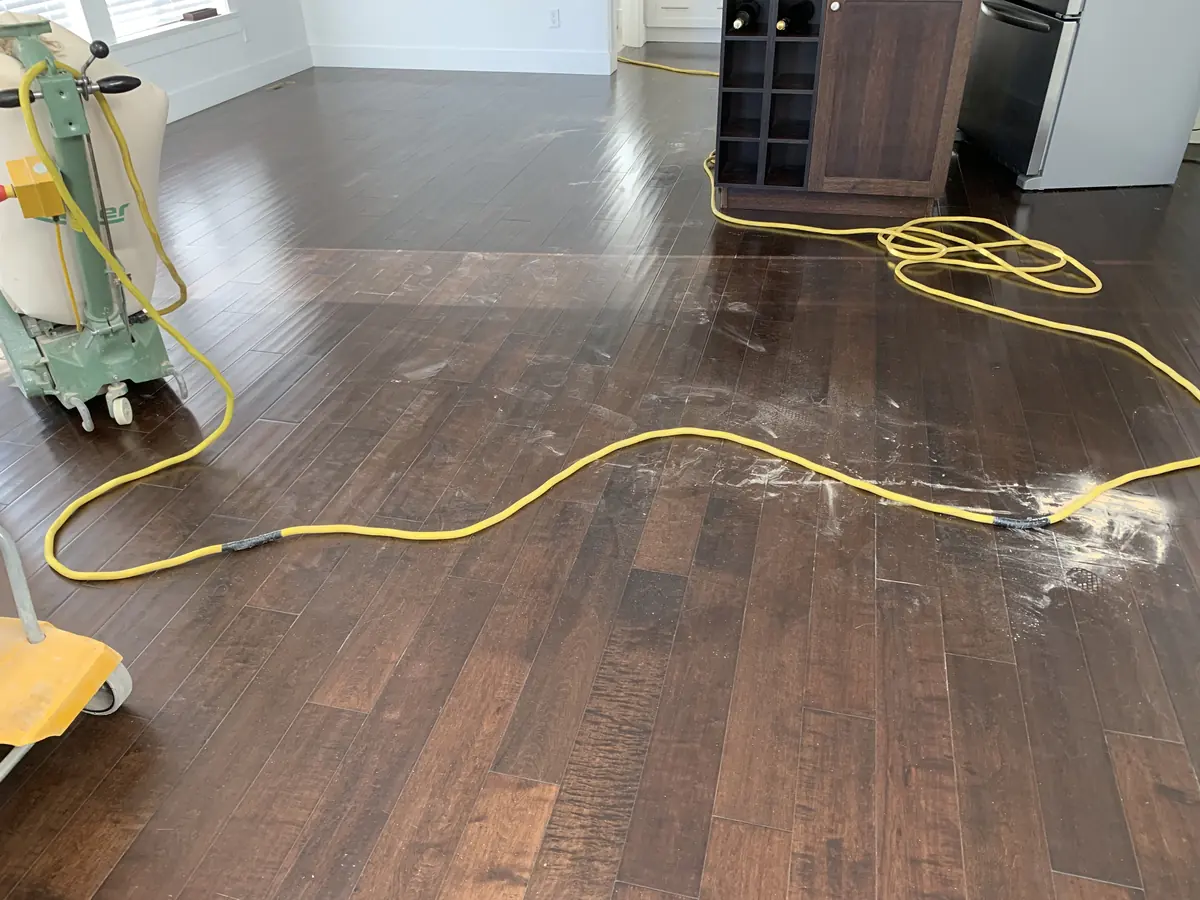 Dark, worn maple floor before sanding