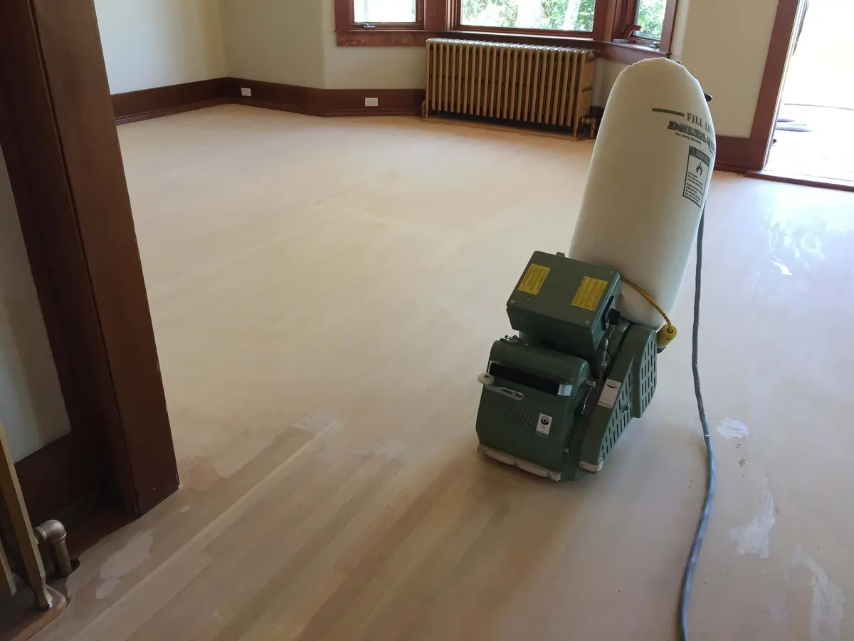 Sanding a bay-window room back to bare wood